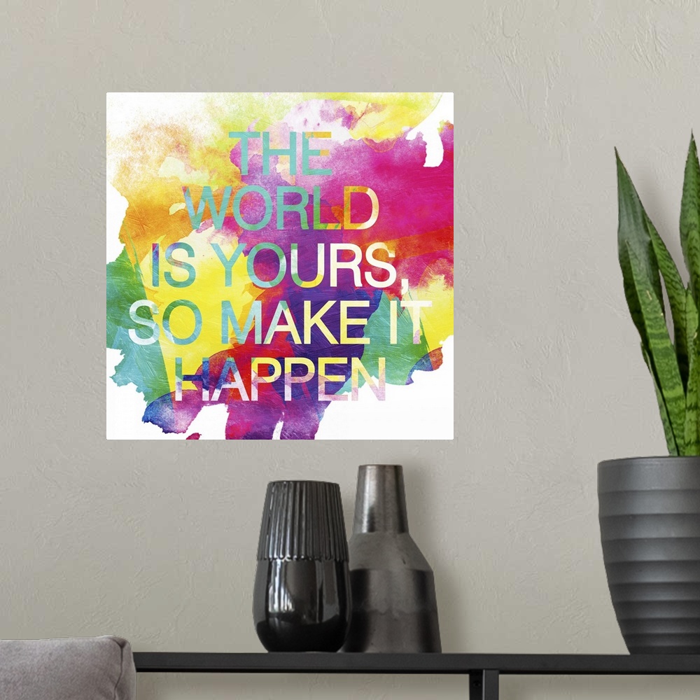 A modern room featuring "The world is yours, so make it happen" over watercolor splashes in bright, vivid colors.