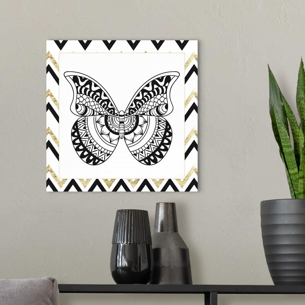 A modern room featuring A symmetrical black and gold designed butterfly.