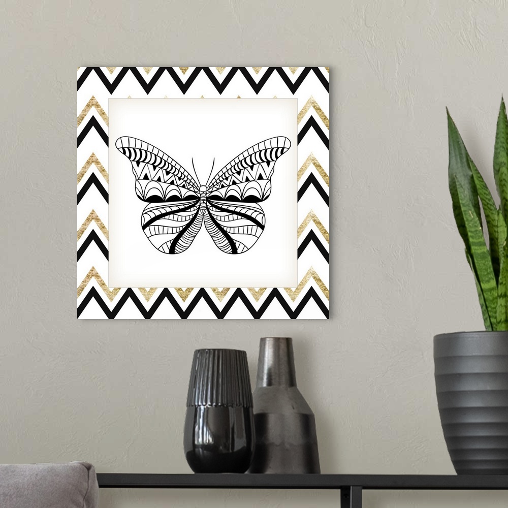 A modern room featuring A symmetrical black and gold designed butterfly.