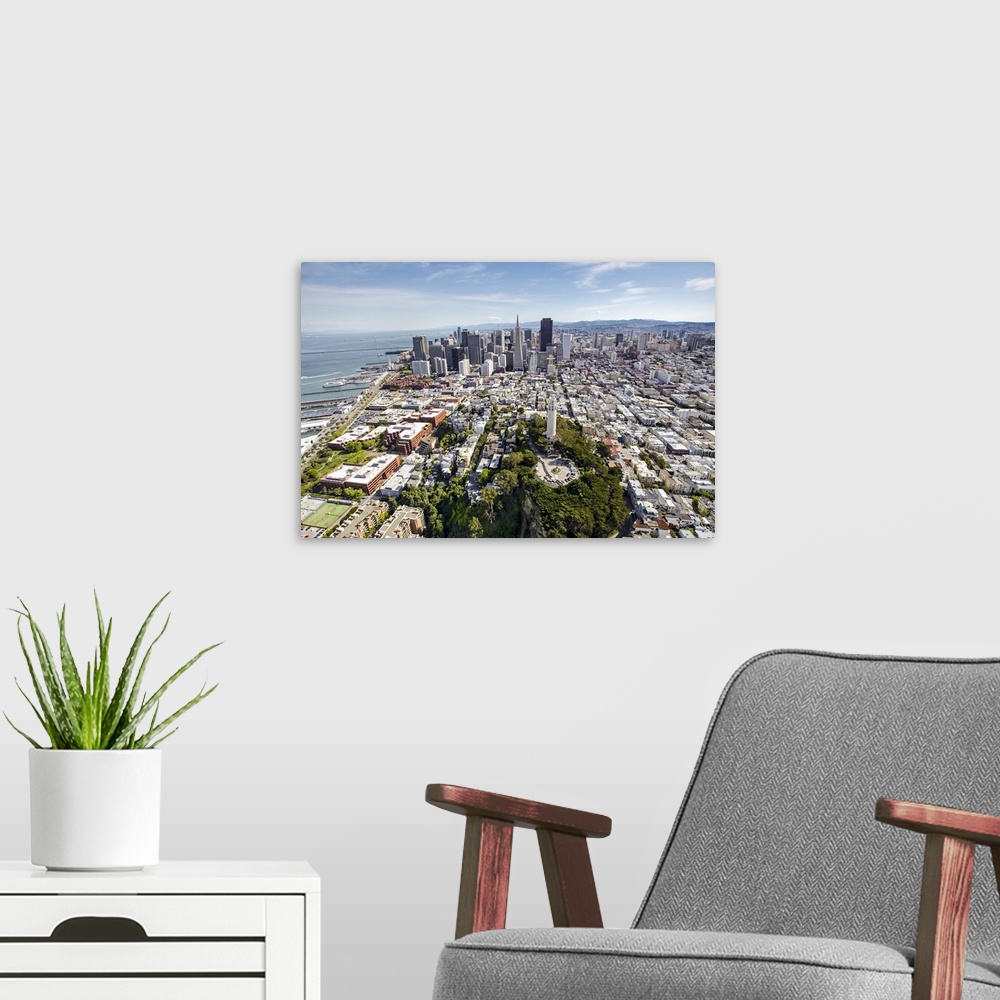 A modern room featuring Aerial photography of skyscrapers in downtown San Francisco.