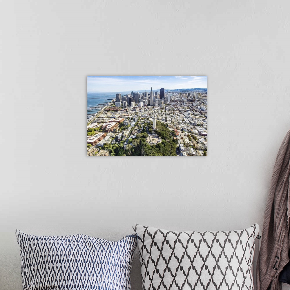 A bohemian room featuring Aerial photography of skyscrapers in downtown San Francisco.