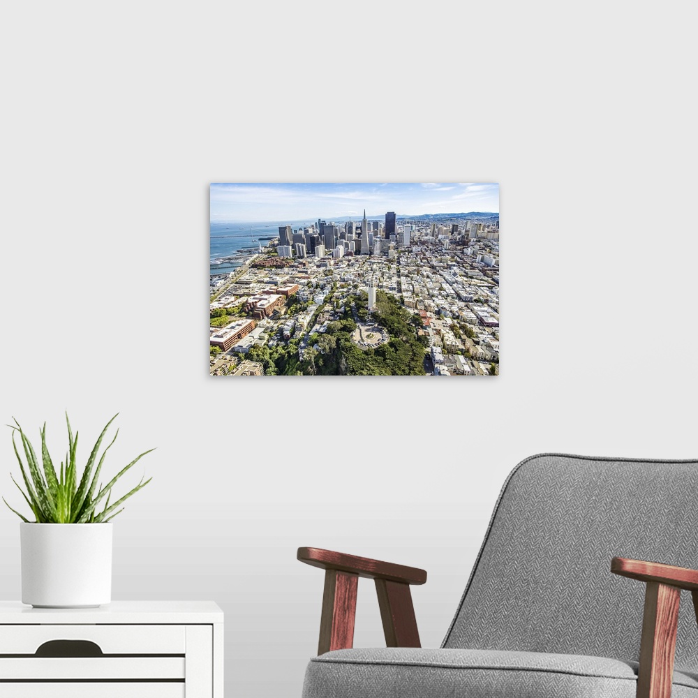 A modern room featuring Aerial photography of skyscrapers in downtown San Francisco.