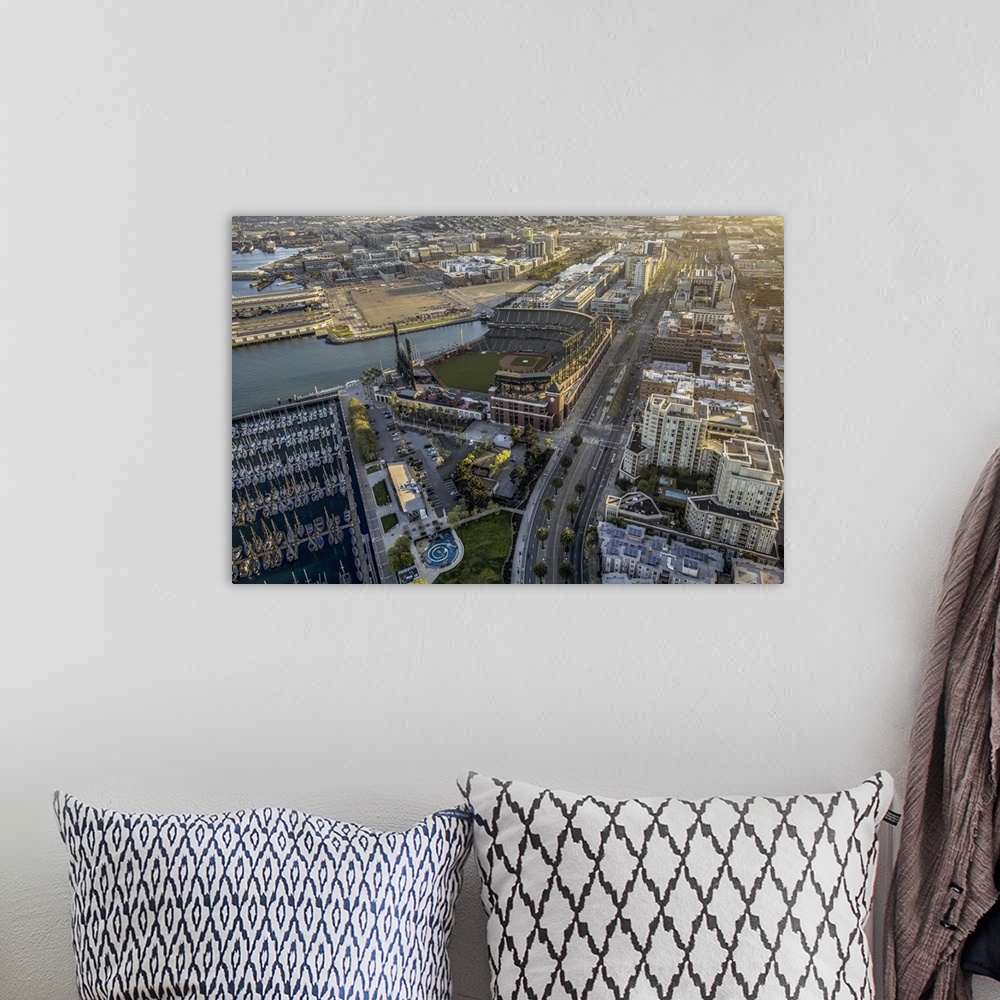A bohemian room featuring Aerial photograph of the city of San Francisco, with a view of the harbor and AT-T Park.