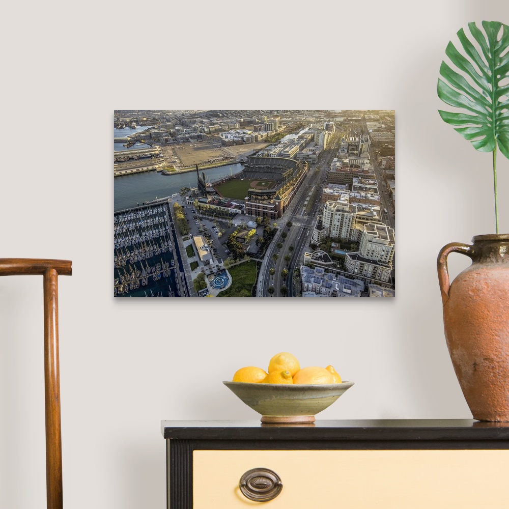 A traditional room featuring Aerial photograph of the city of San Francisco, with a view of the harbor and AT-T Park.