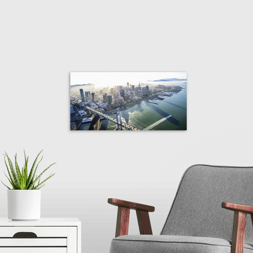 A modern room featuring Aerial photograph of the city of San Francisco with the Bay Bridge in the morning.