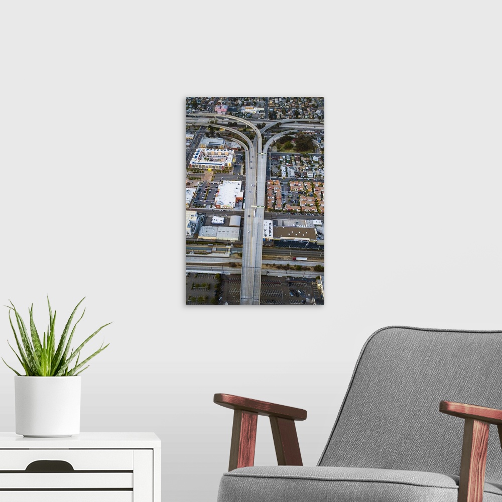 A modern room featuring Aerial photograph of a freeway overpass in San Diego.