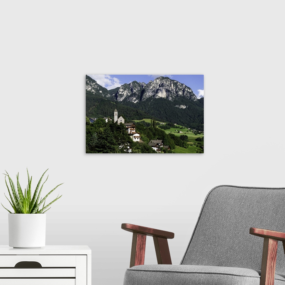 A modern room featuring Aerial capture of stunningly beautiful Vols Am Schlern, Northern Italy.