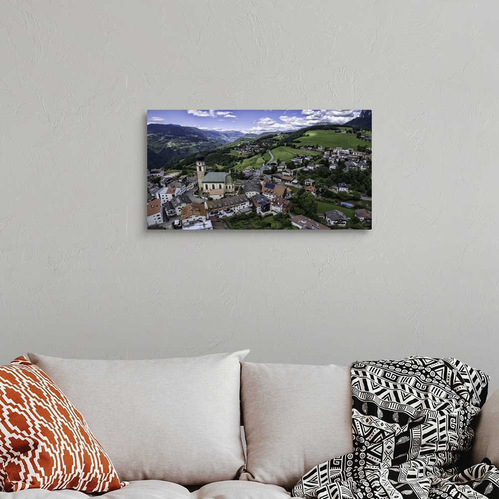 A bohemian room featuring Aerial capture of stunningly beautiful Vols Am Schlern, Northern Italy.