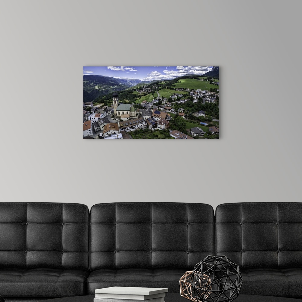 A modern room featuring Aerial capture of stunningly beautiful Vols Am Schlern, Northern Italy.