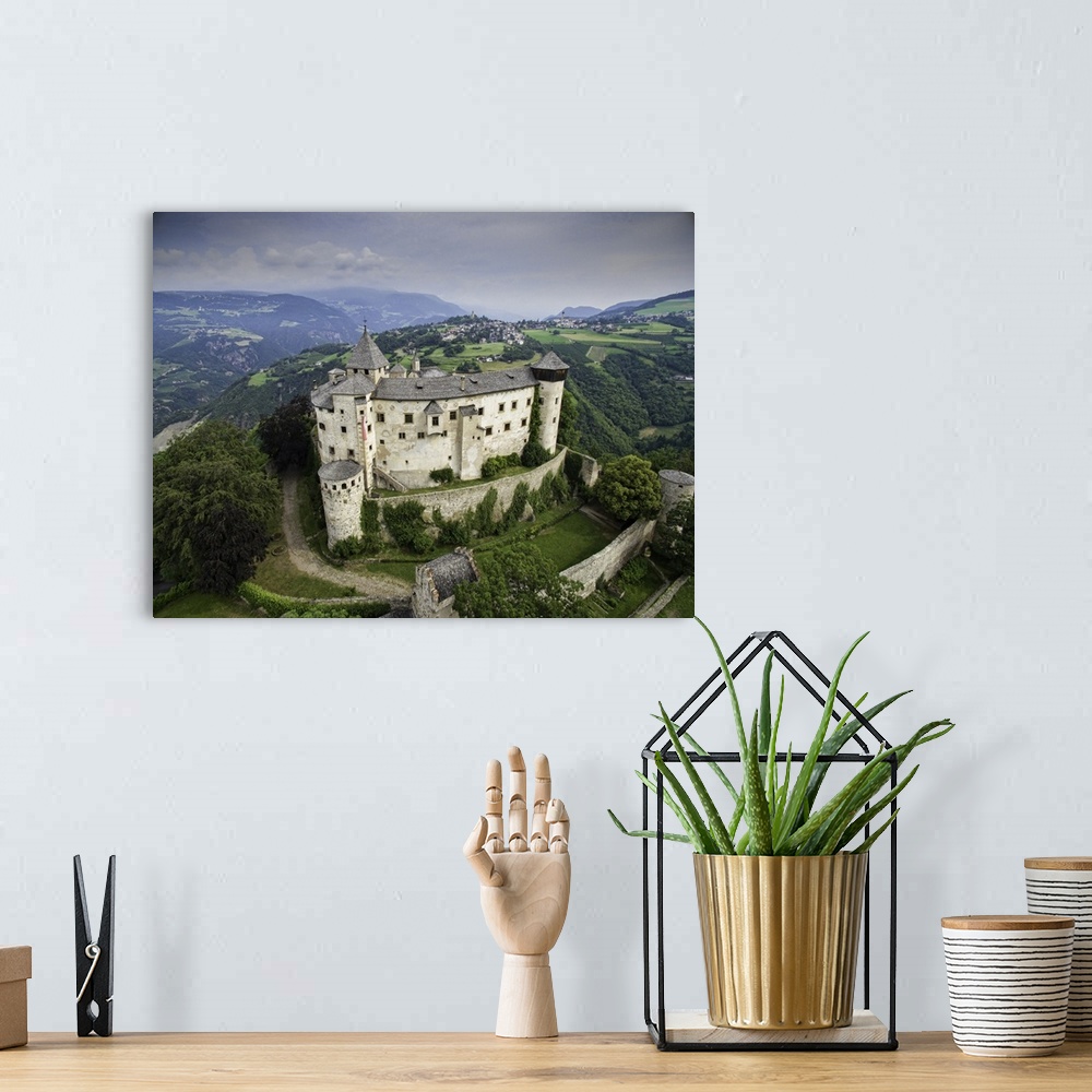 A bohemian room featuring Castle Proesels, Italian Dolomites. This is a three image aerial view of Castle Proesels. The cas...