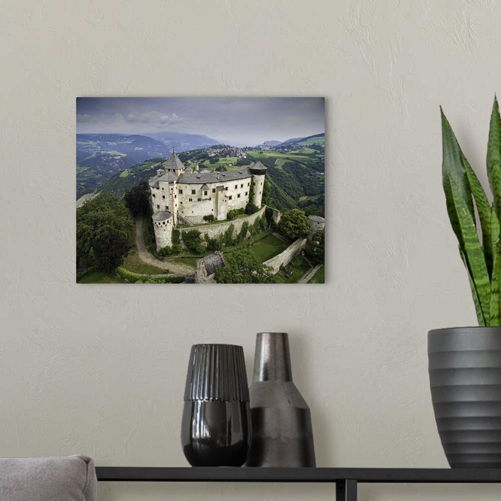 A modern room featuring Castle Proesels, Italian Dolomites. This is a three image aerial view of Castle Proesels. The cas...
