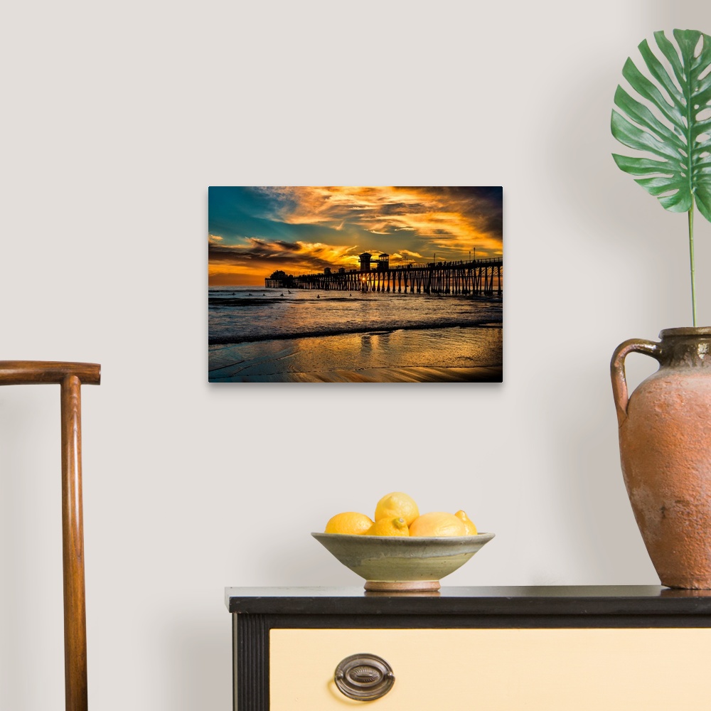 A traditional room featuring Surfers near a Southern California Pier, the Oceanside Pier.