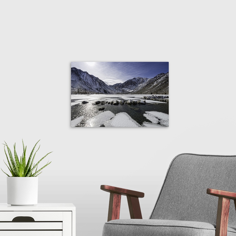 A modern room featuring Scenic Convict Lake half frozen in the Winter. Convict Lake is near Mammoth Lakes in California's...