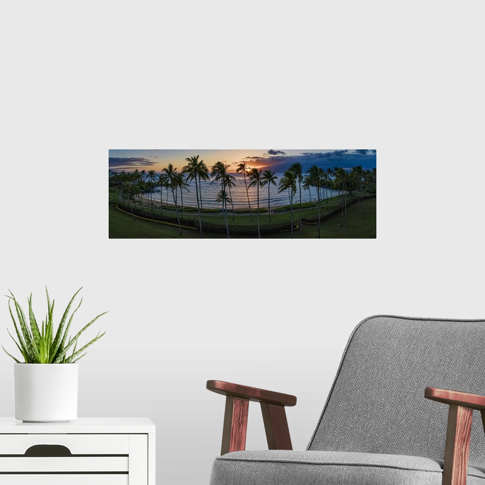 A modern room featuring Stunning Kapalua Bay in Maui, Hawaii, USA. This is a 4 image aerial panoramic at sunset.
