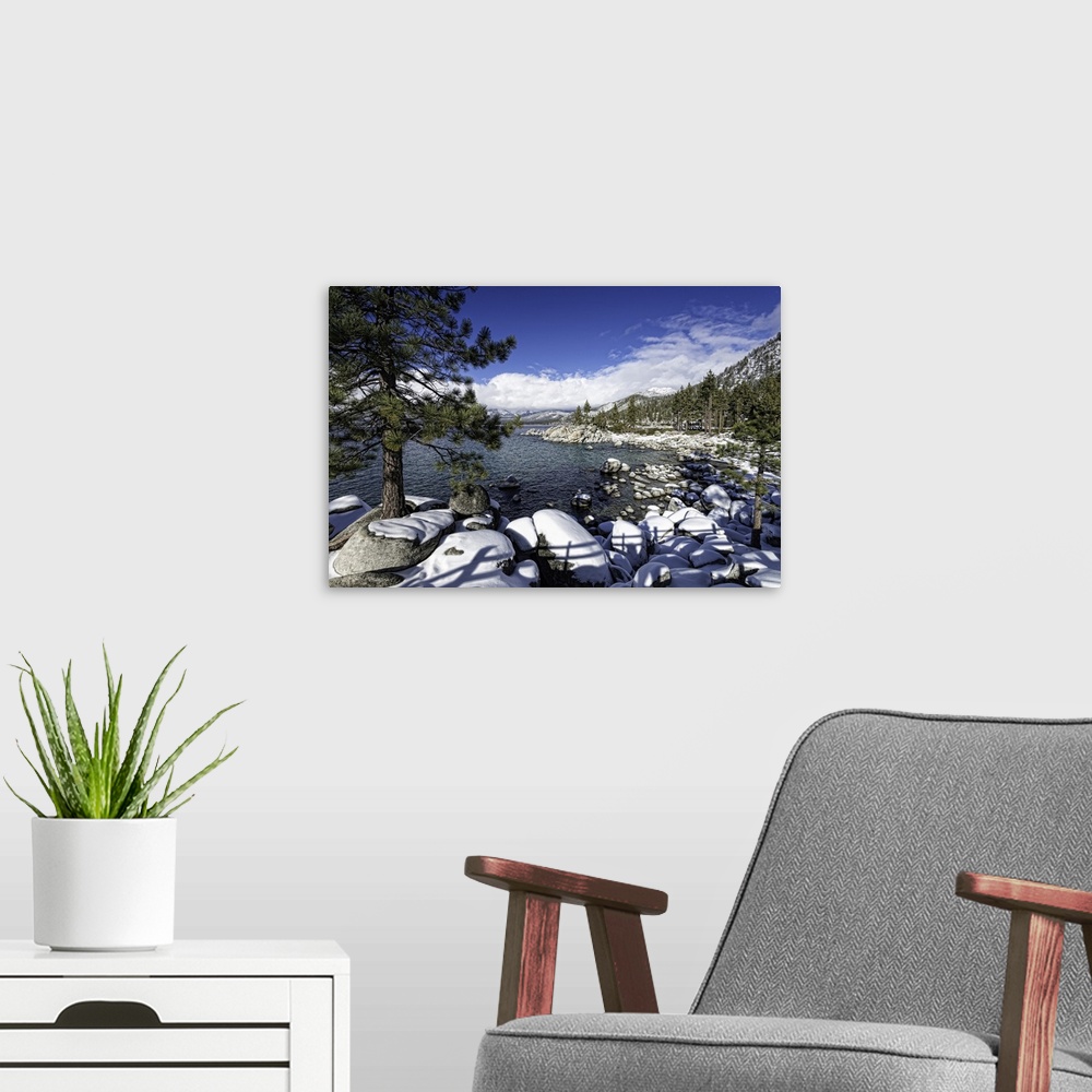 A modern room featuring Lake Tahoe's Sand Harbor in winter. Lake Tahoe is a very large lake that's in both California and...