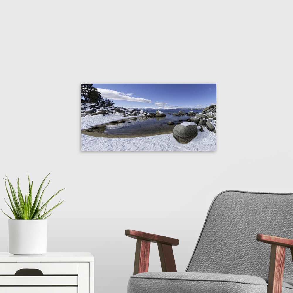 A modern room featuring This is a huge panoramic of Lake Tahoe's Sand Harbor in winter. Lake Tahoe is a very large lake t...