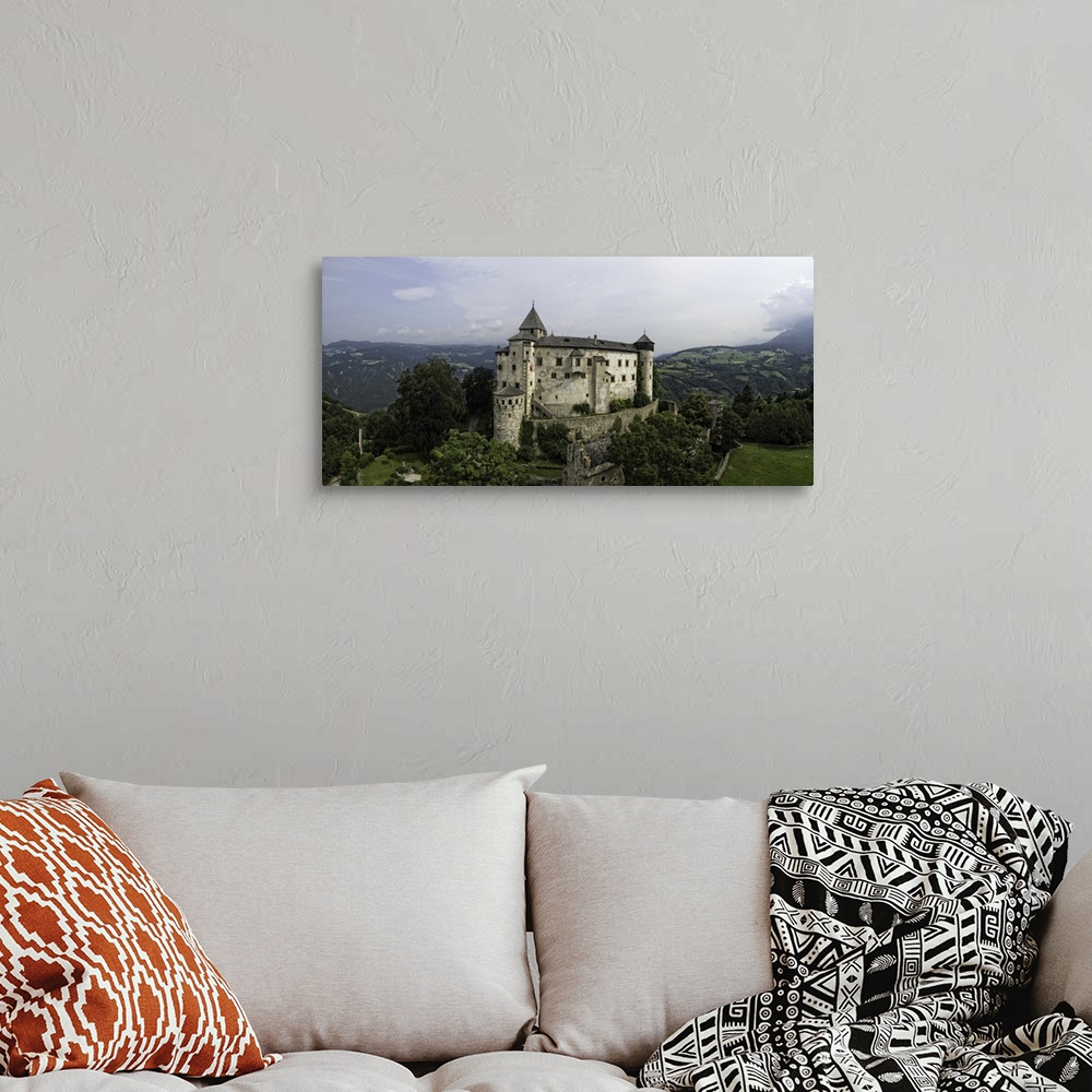A bohemian room featuring Stunning Castle Proesels in the Italian Dolomites. This is a three image aerial view of Castle Pr...