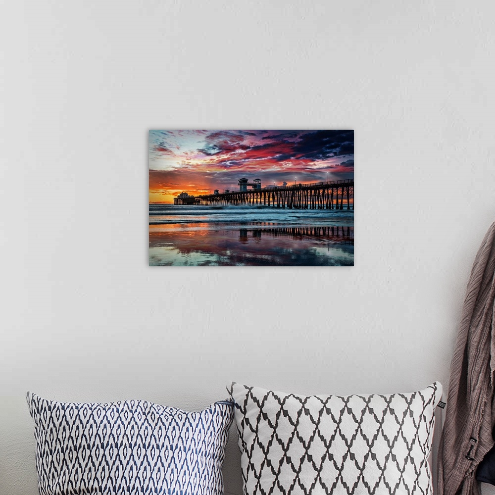 A bohemian room featuring Summer sunset at the Oceanside Pier. The Oceanside Pier is silhouetted as sunset turns the reflec...