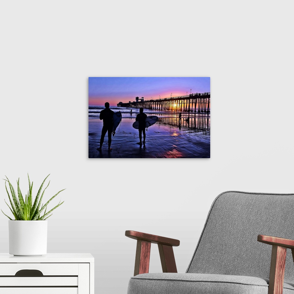 A modern room featuring Surfers at sunset near the iconic Oceanside Pier. Oceanside is 35 miles North of San Diego, Calif...