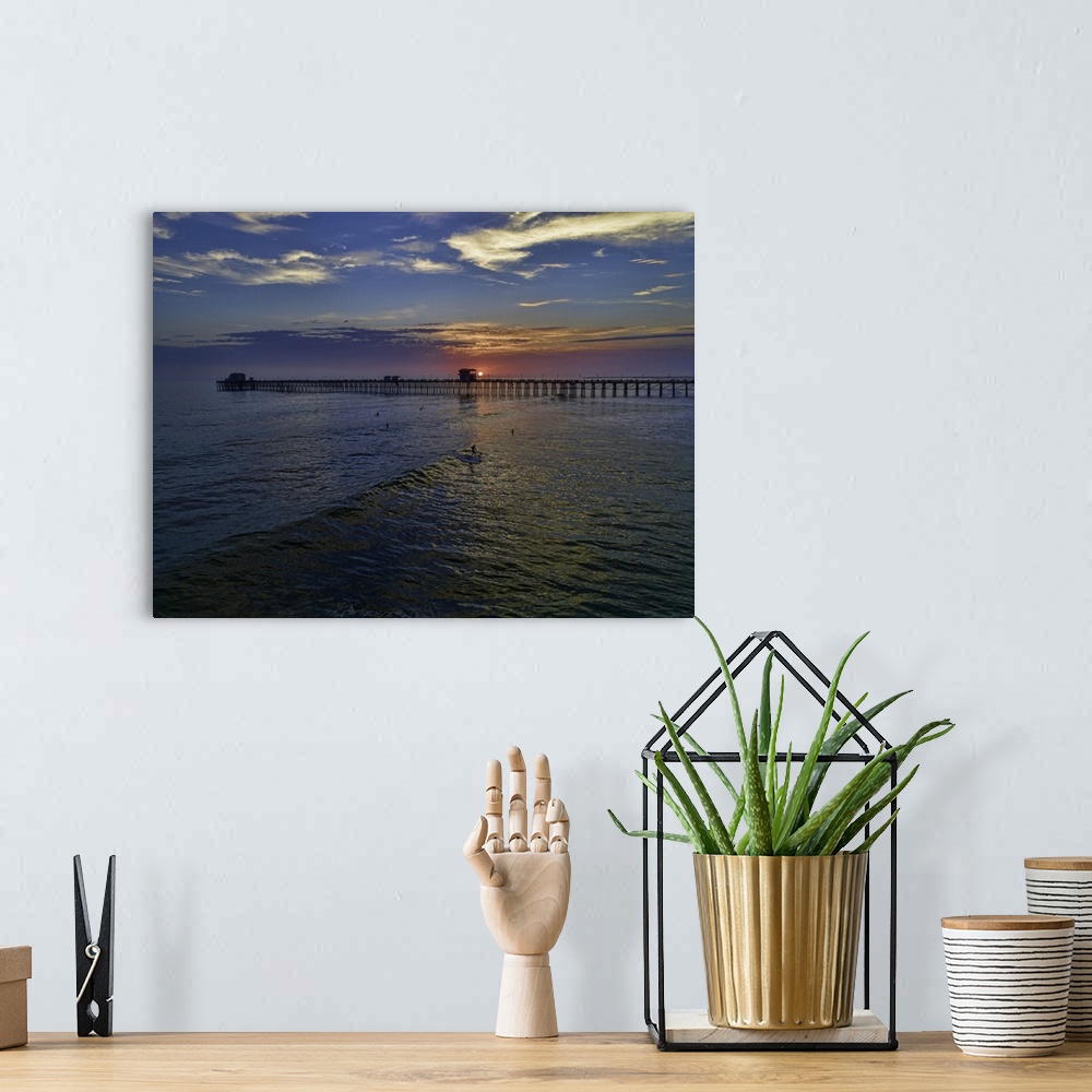 A bohemian room featuring Surfers at sunset near the iconic Oceanside Pier. Oceanside is 35 miles North of San Diego, Calif...