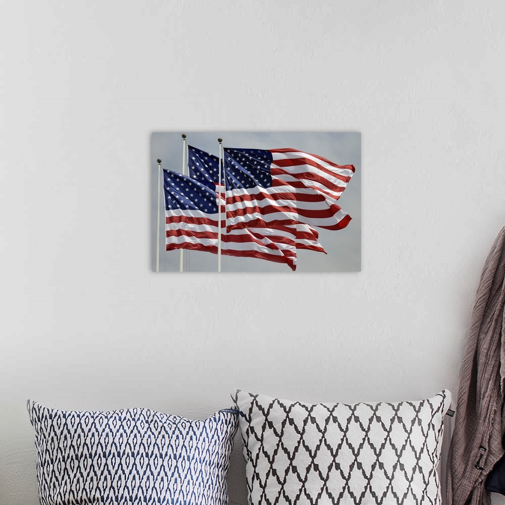 A bohemian room featuring Three American flags flying