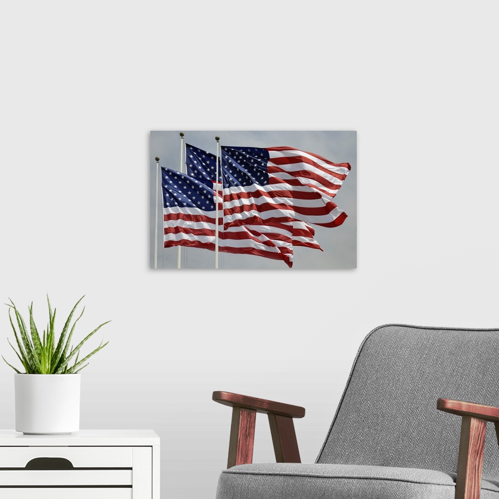 A modern room featuring Three American flags flying