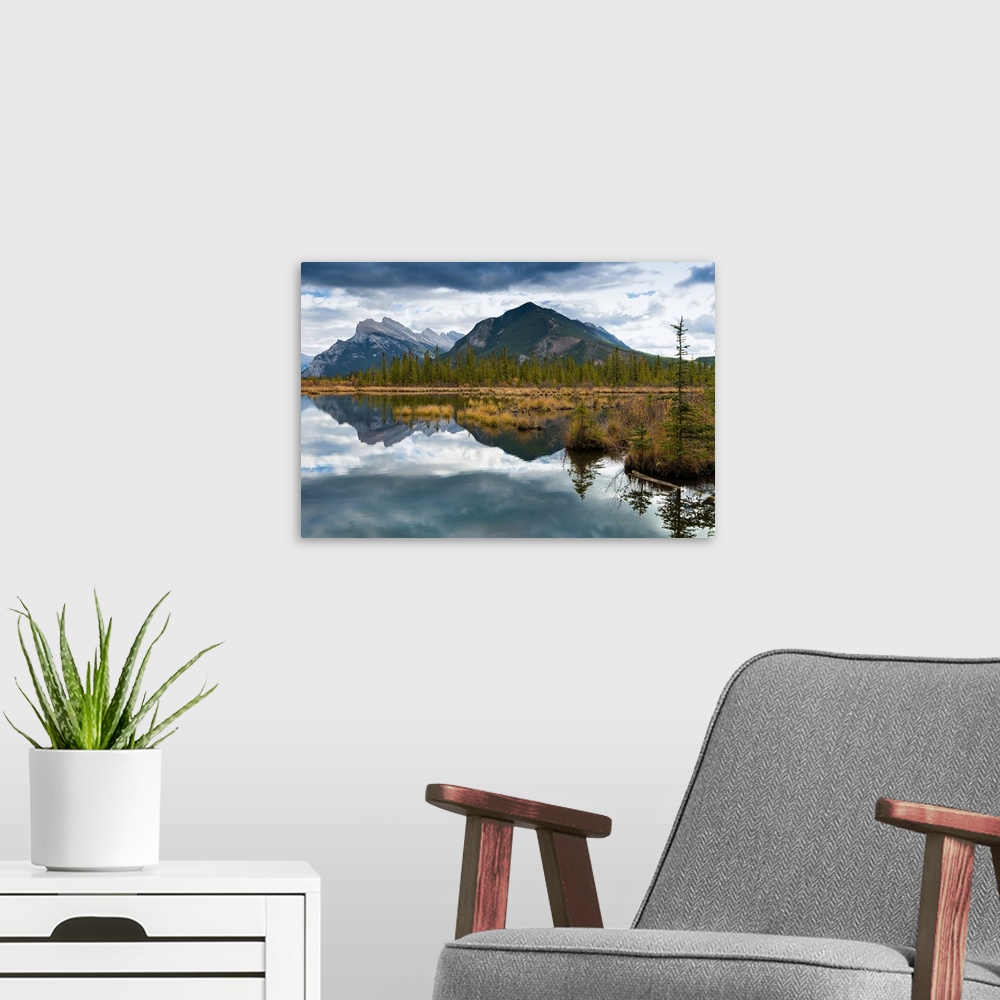A modern room featuring Reflections across Vermilion Lakes with view of Mount Rundle and Sulfer Mountain in the distance....
