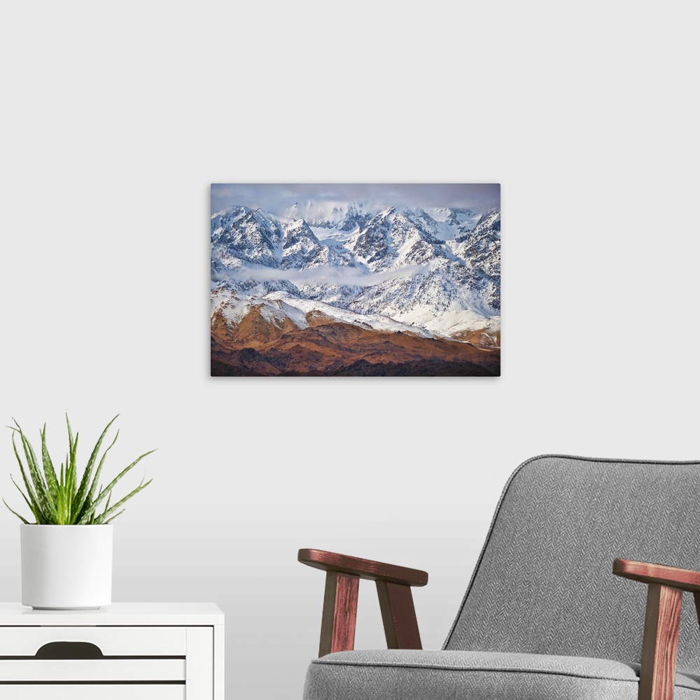 A modern room featuring Wintry mountains with snow-capped peaks along California's 395 in the Eastern Sierras.