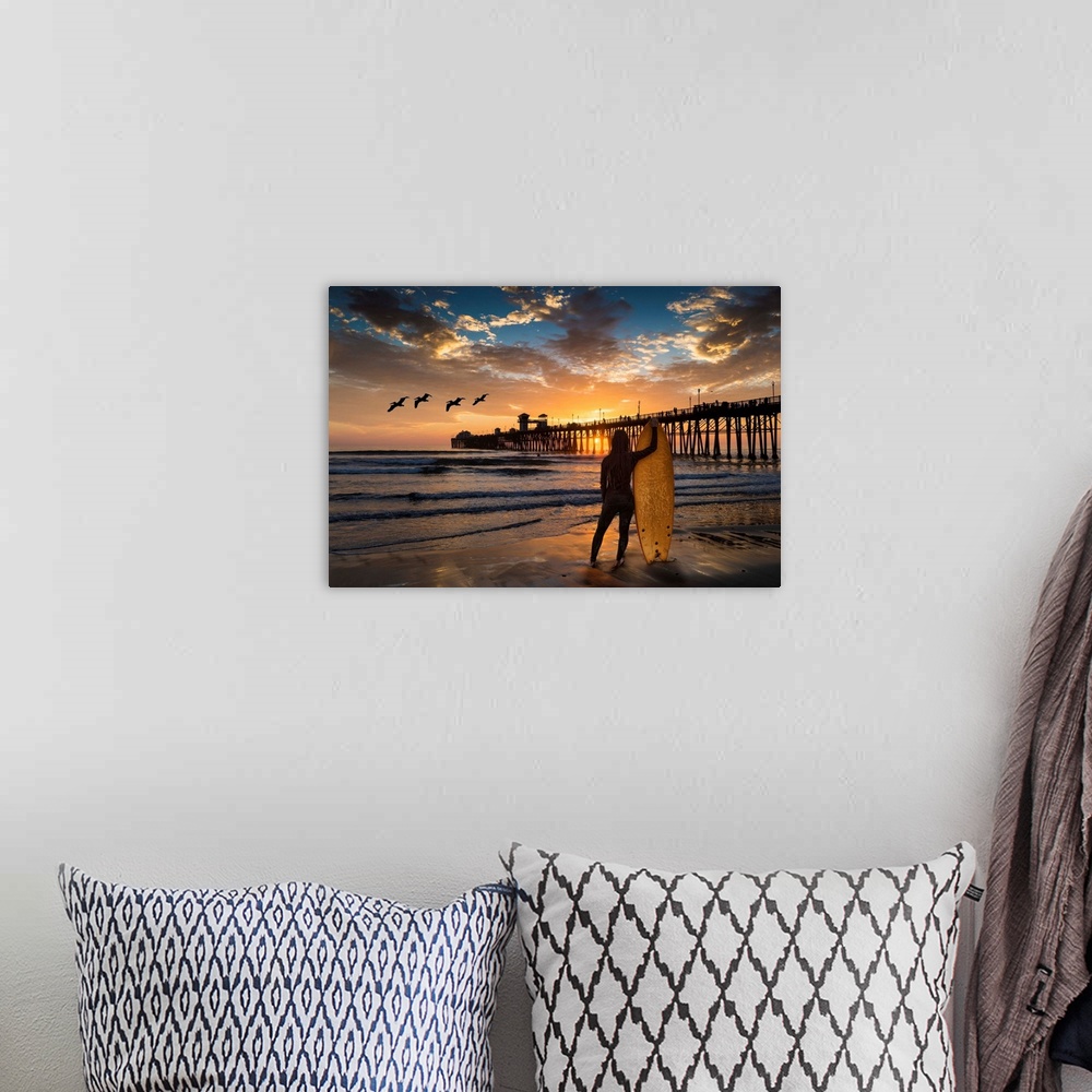 A bohemian room featuring Woman surfer silhouetted at Oceanside Pier. The surf next to the Oceanside pier is a favorite sur...