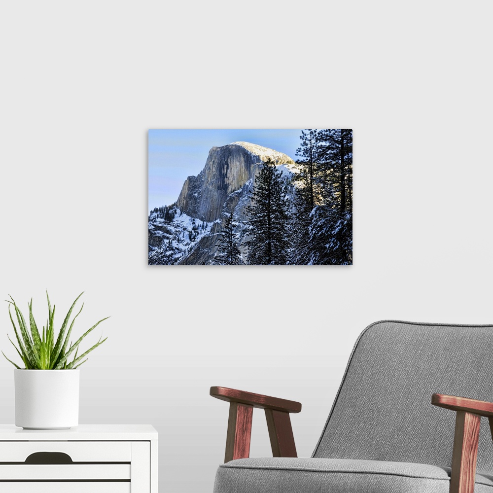 A modern room featuring Yosemite's Half Dome in winter. Yosemite national park is in California, USA.