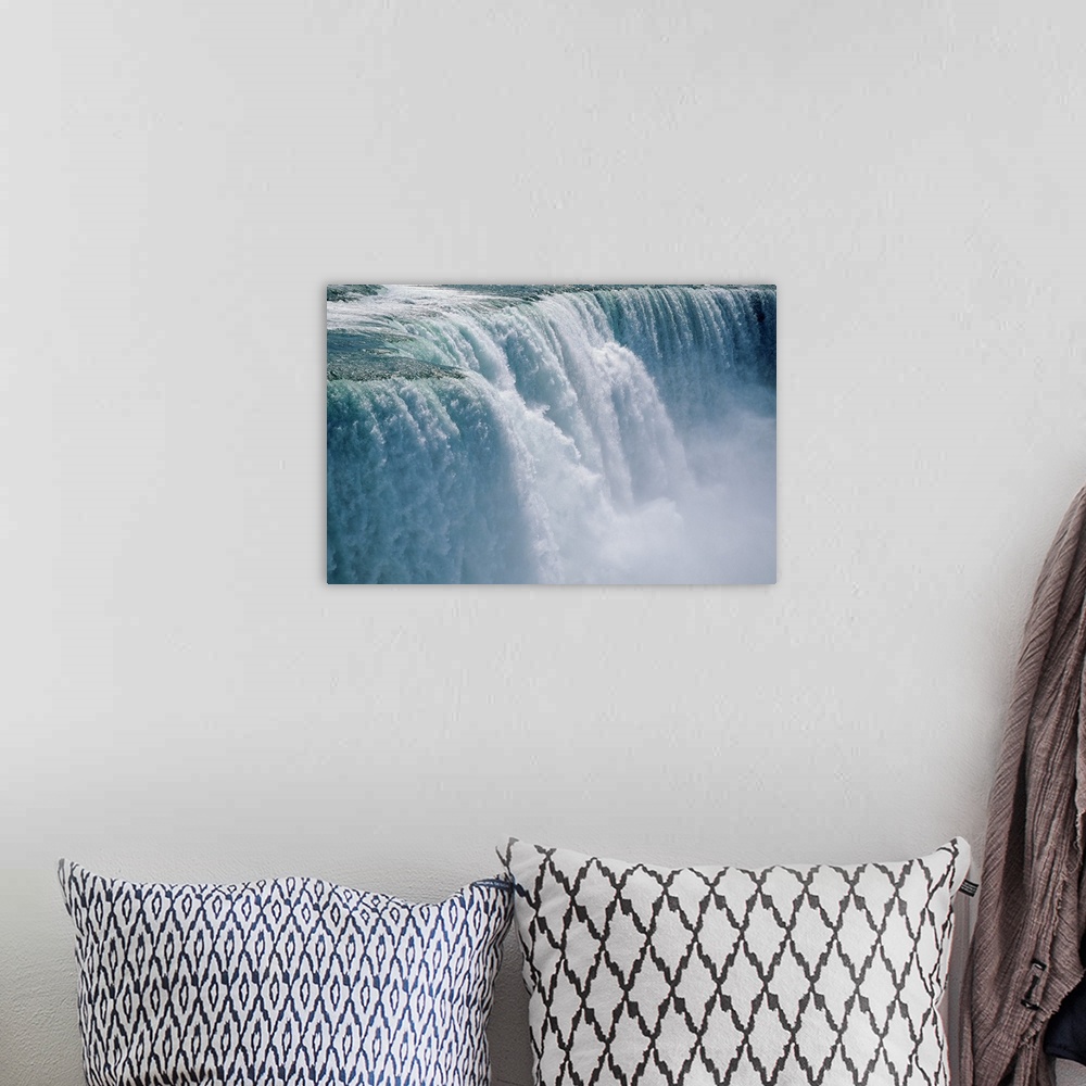A bohemian room featuring Photograph taken of an immense waterfall in Niagara Falls.