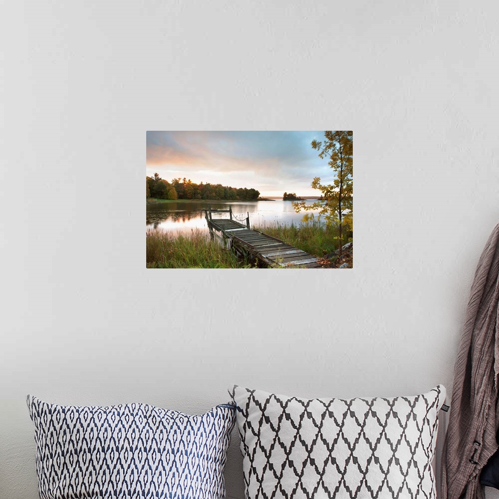 A bohemian room featuring A Dock On A Lake At Sunrise Near Wawa; Ontario, Canada
