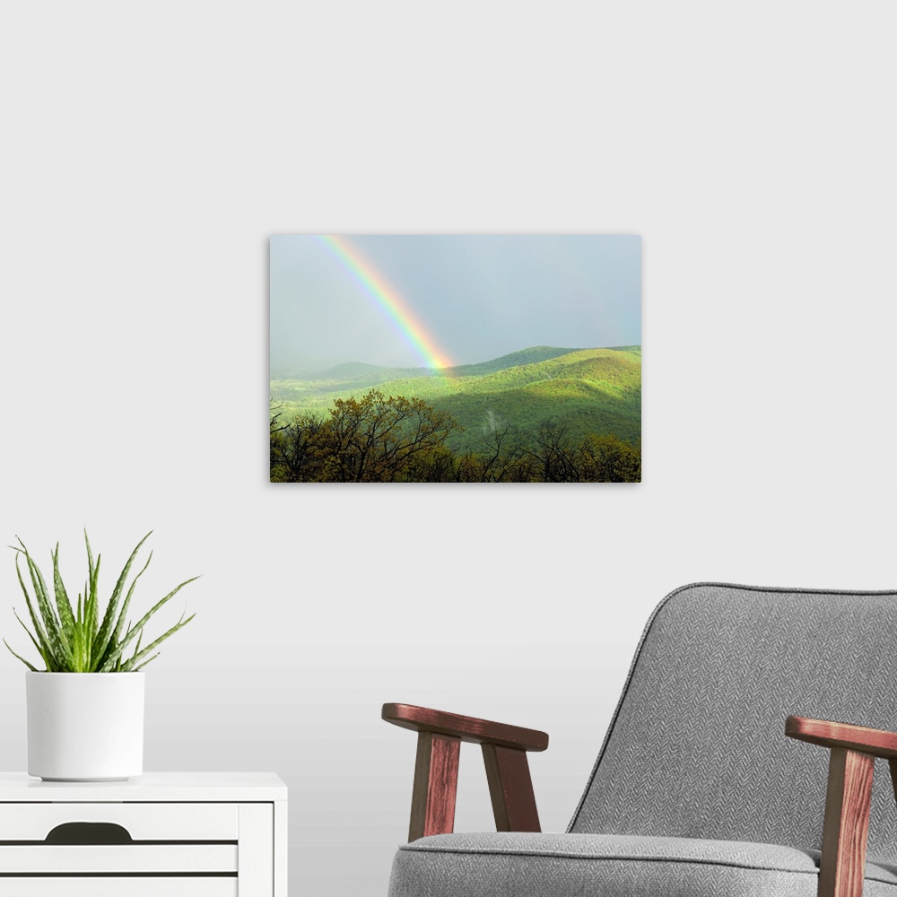 A modern room featuring A large rainbow over the Shenandoah Valley in late afternoon.