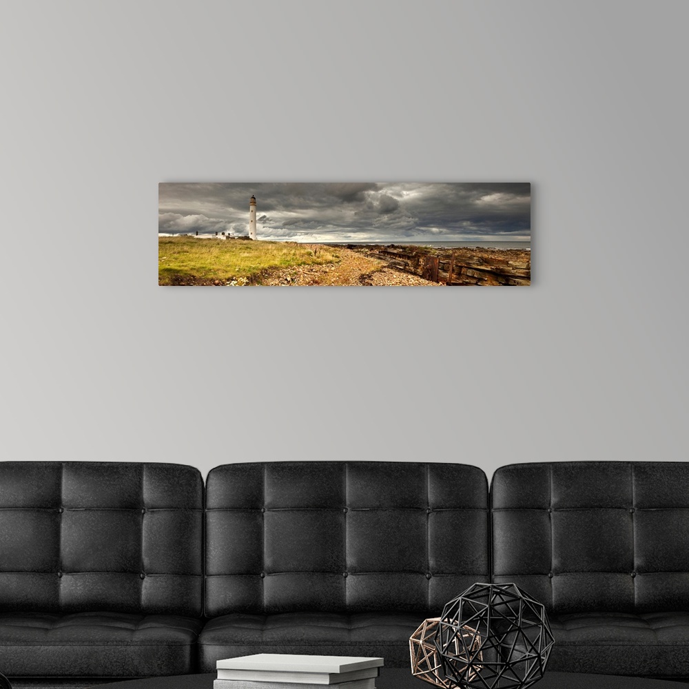 A modern room featuring A Lighthouse And Piles Of Logs On The Shore, Lothian Scotland