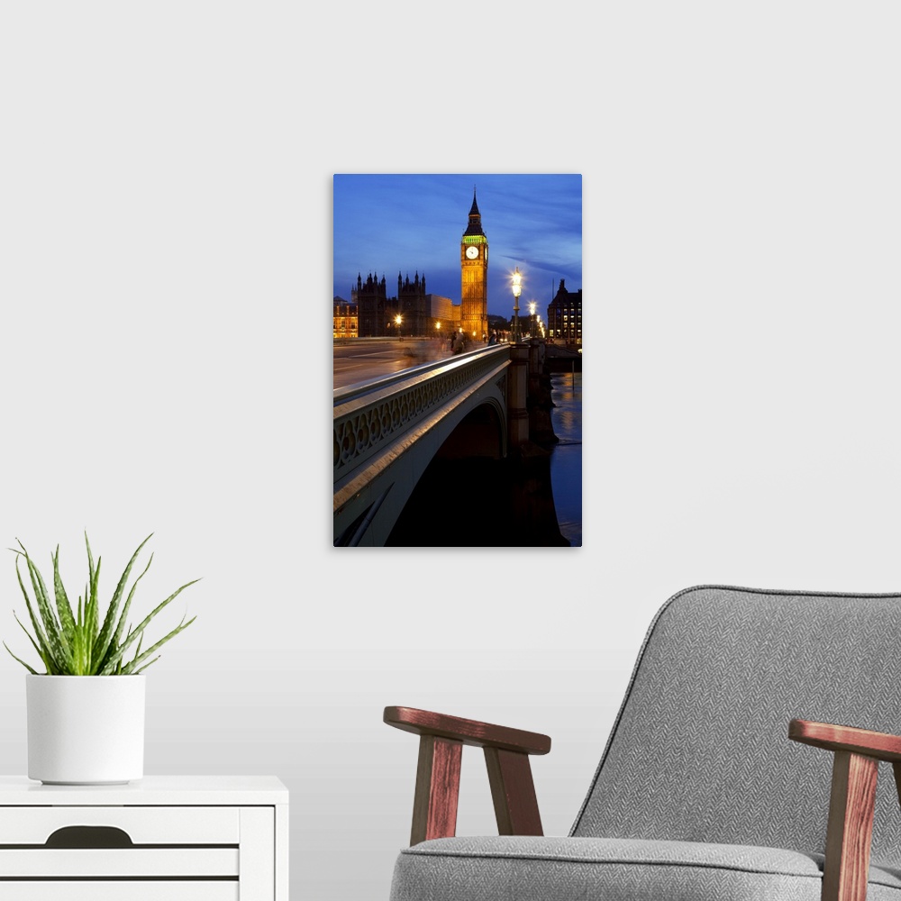A modern room featuring A night view across Westminster Bridge with Big Ben in the distance.