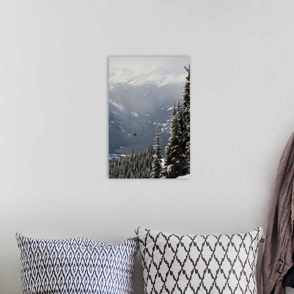 A bohemian room featuring A Red Cable Car Riding Over Snow Covered Forest, Whistler, BC, Canada