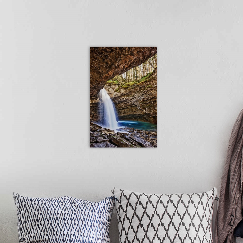 A bohemian room featuring A River Cascades Over A Small Waterfall In Johnston Canyon In Banff National Park; Banff Alberta ...