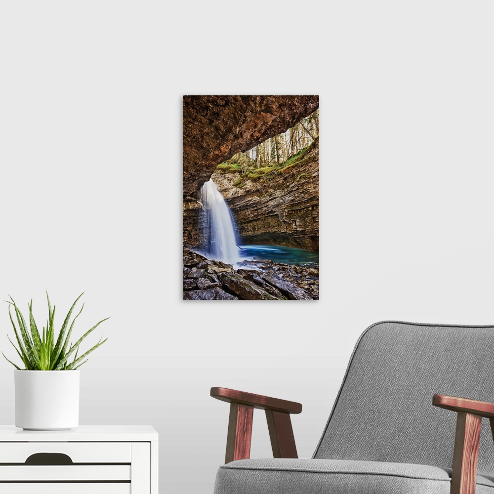 A modern room featuring A River Cascades Over A Small Waterfall In Johnston Canyon In Banff National Park; Banff Alberta ...