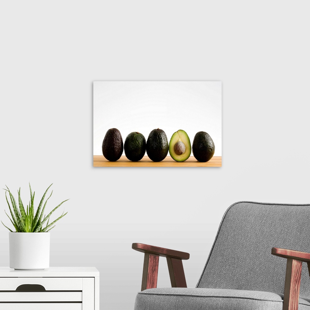 A modern room featuring A Row Of Avocados With Interior Of One Showing Standing Upright