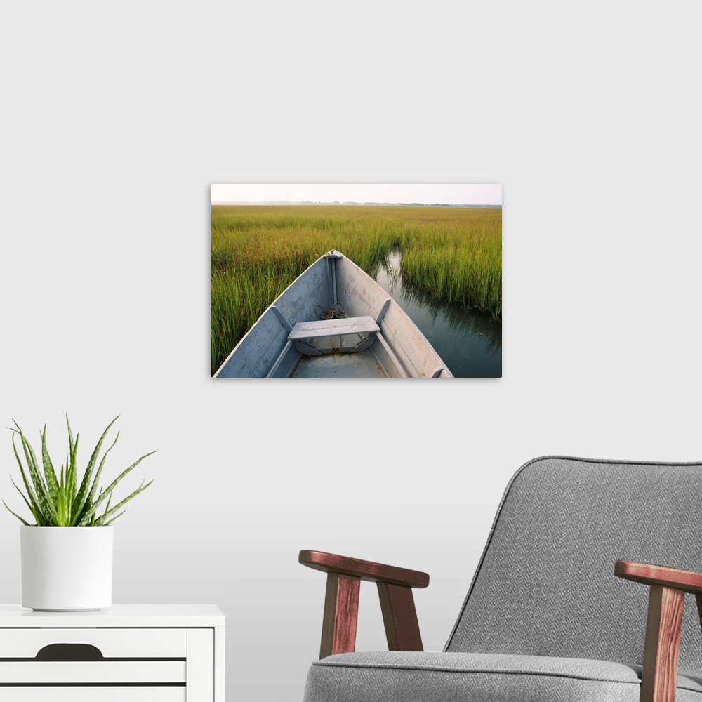 A modern room featuring A rowboat rests in the marsh of Assateague Island.