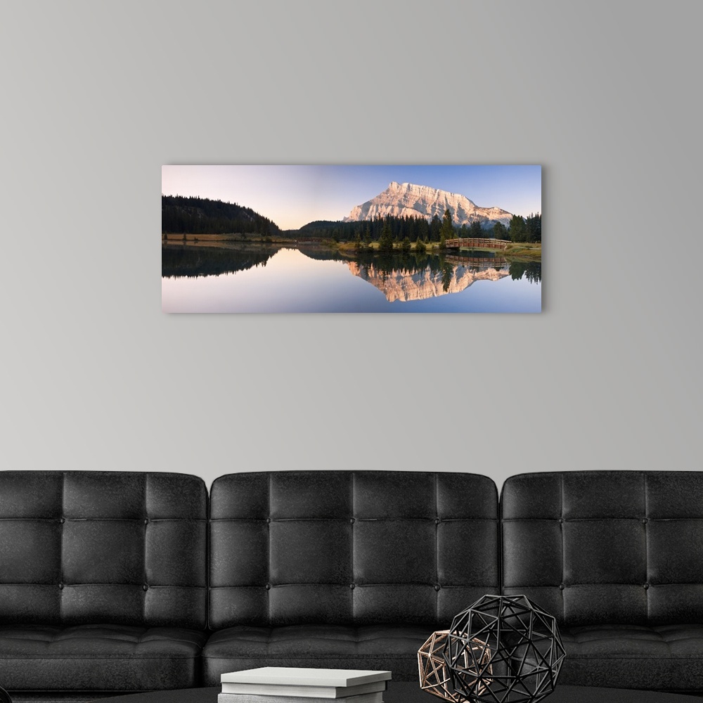 A modern room featuring A Scenic Shot Of A Mountainside And Small Bridge; Banff National Park, Alberta, Canada