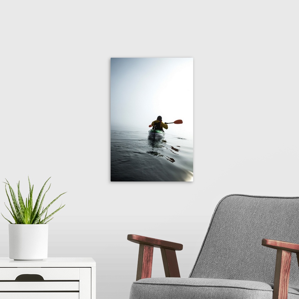 A modern room featuring A Sea Kayaker Paddles Into Thick Fog On On A Calm Morning In Alaska