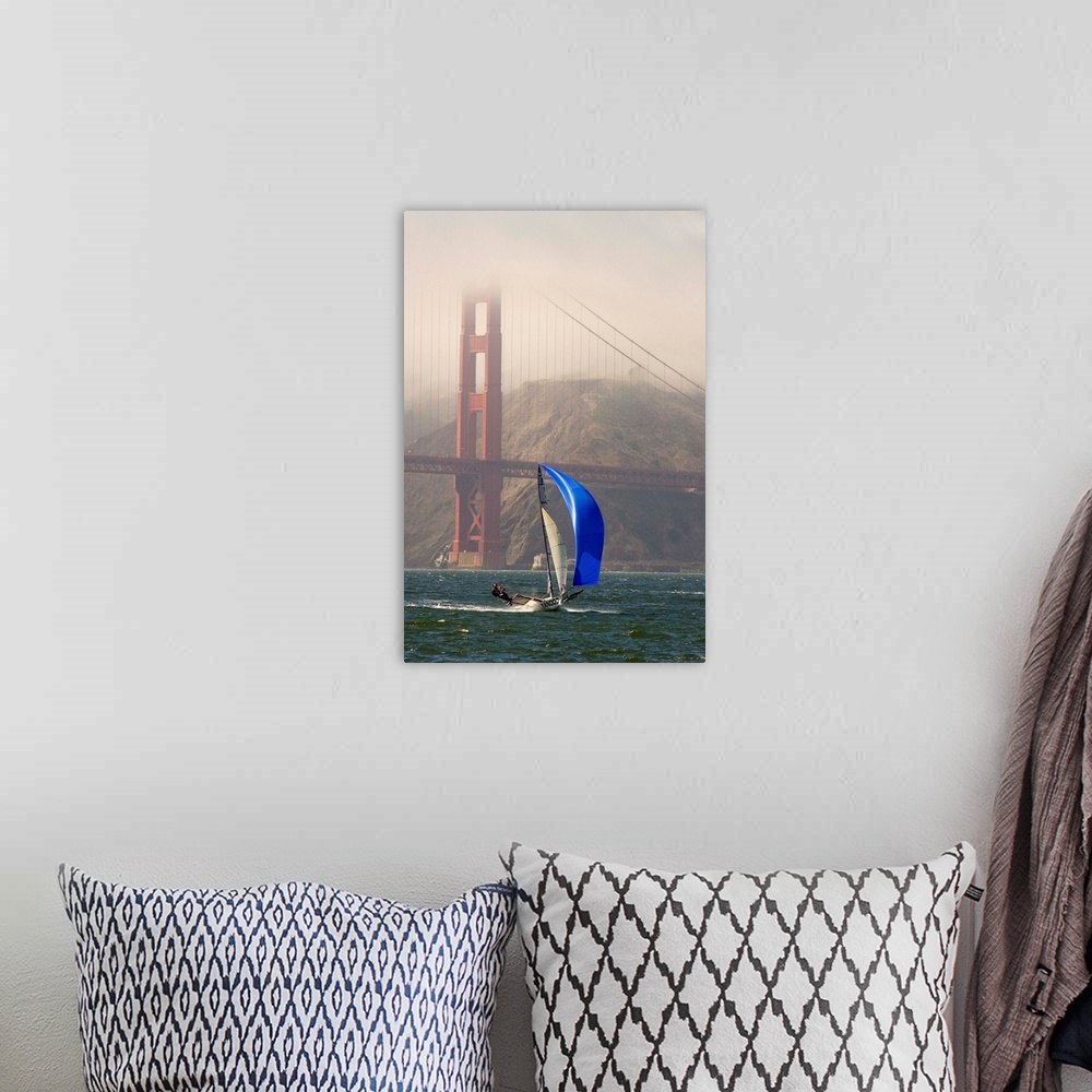 A bohemian room featuring A Skiff sails in the San Francisco Bay near the Golden Gate Bridge