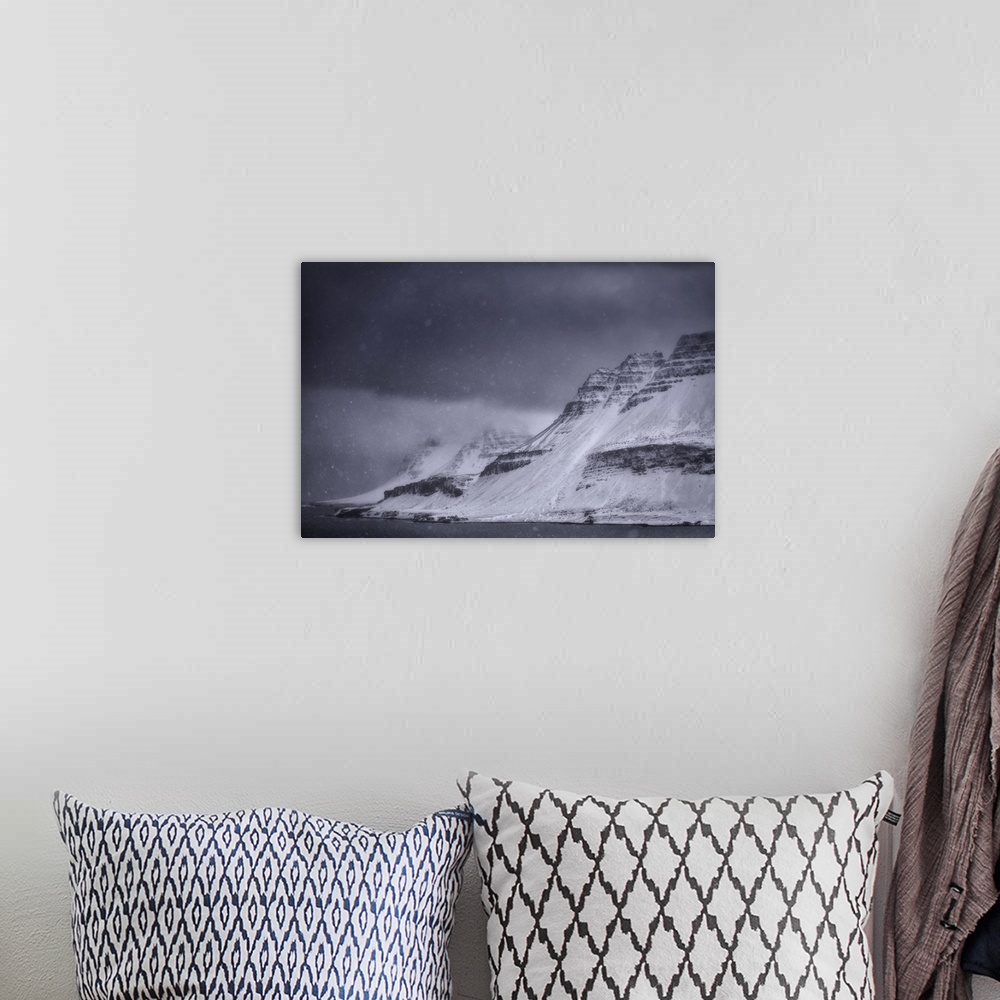 A bohemian room featuring A snowstorm along the Strandir coast on Iceland's west fjords. Iceland.