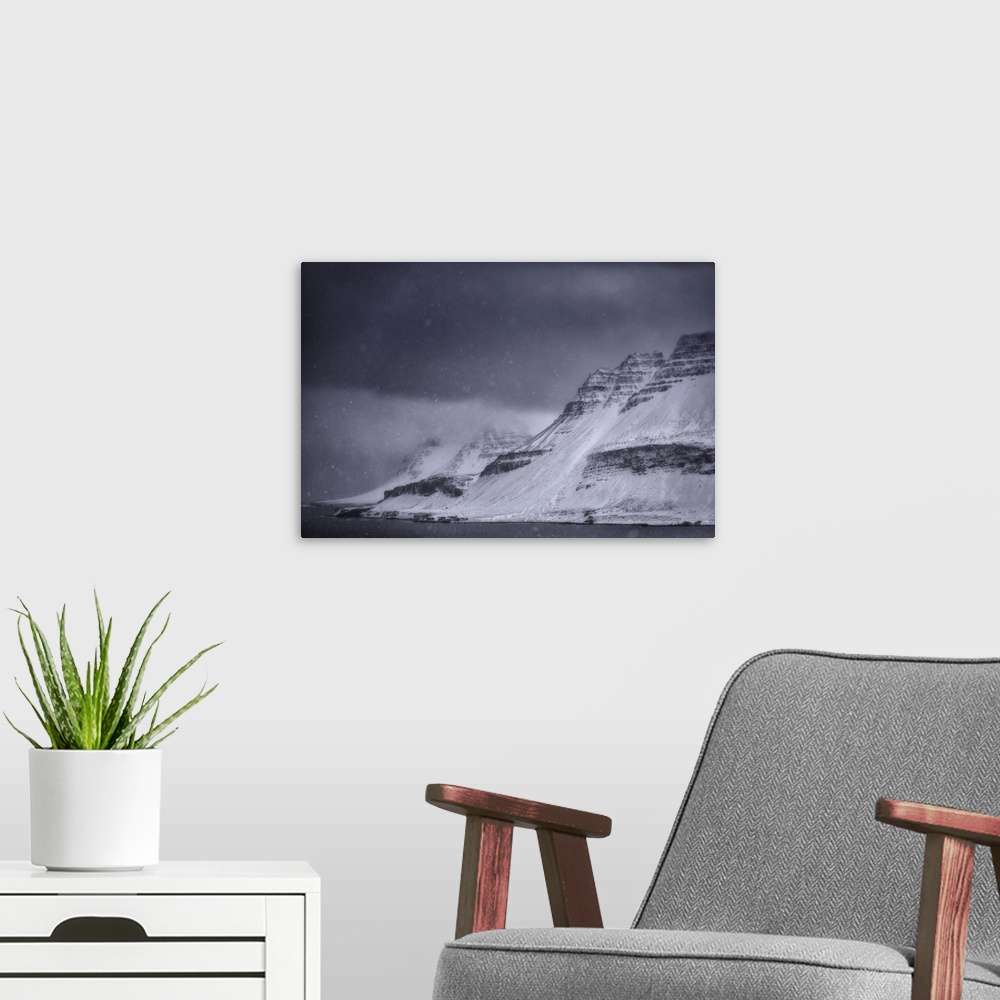 A modern room featuring A snowstorm along the Strandir coast on Iceland's west fjords. Iceland.