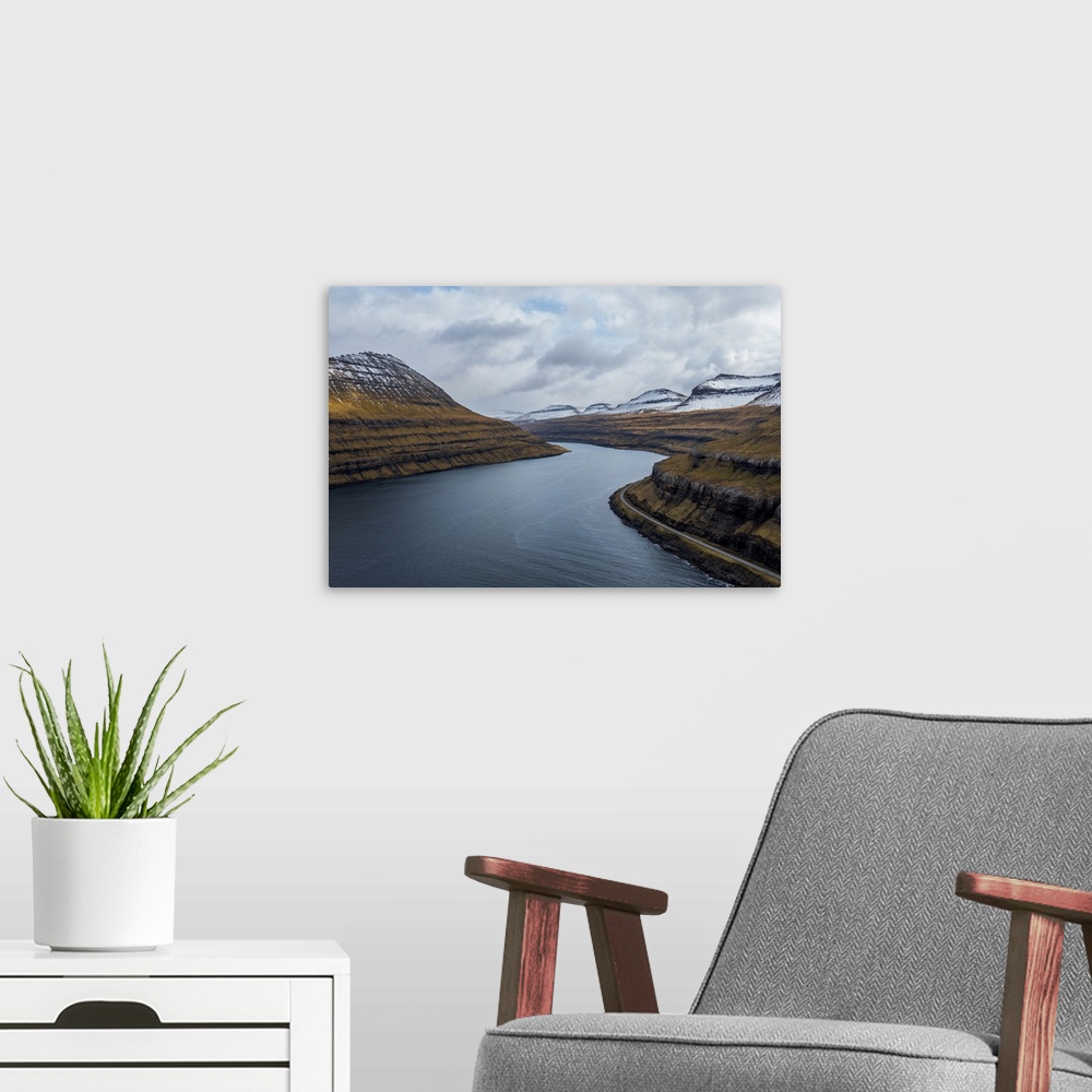 A modern room featuring A view across Funningur on the Faroe Islands.