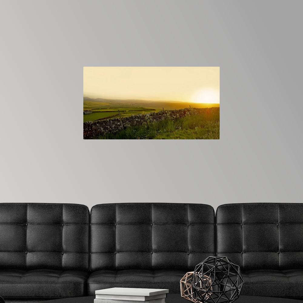 A modern room featuring A view across the Yorkshire Dales at sunset.