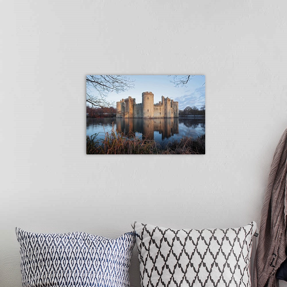A bohemian room featuring A view of Bodiam Castle with reflection in the water.