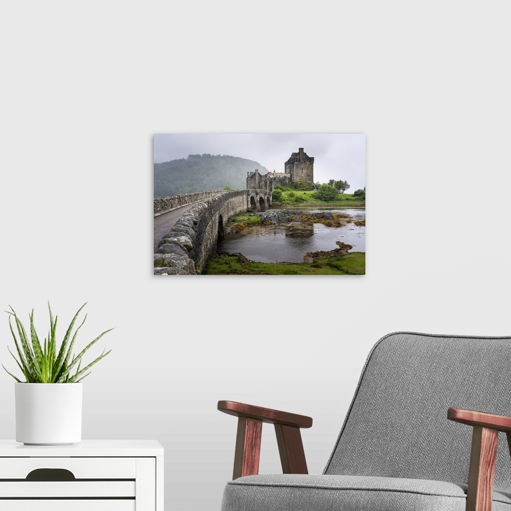 A modern room featuring A view of Eilean Donan Castle and its causeway bridge in Kyle of Lochalsh, Scotland Kyle of Locha...