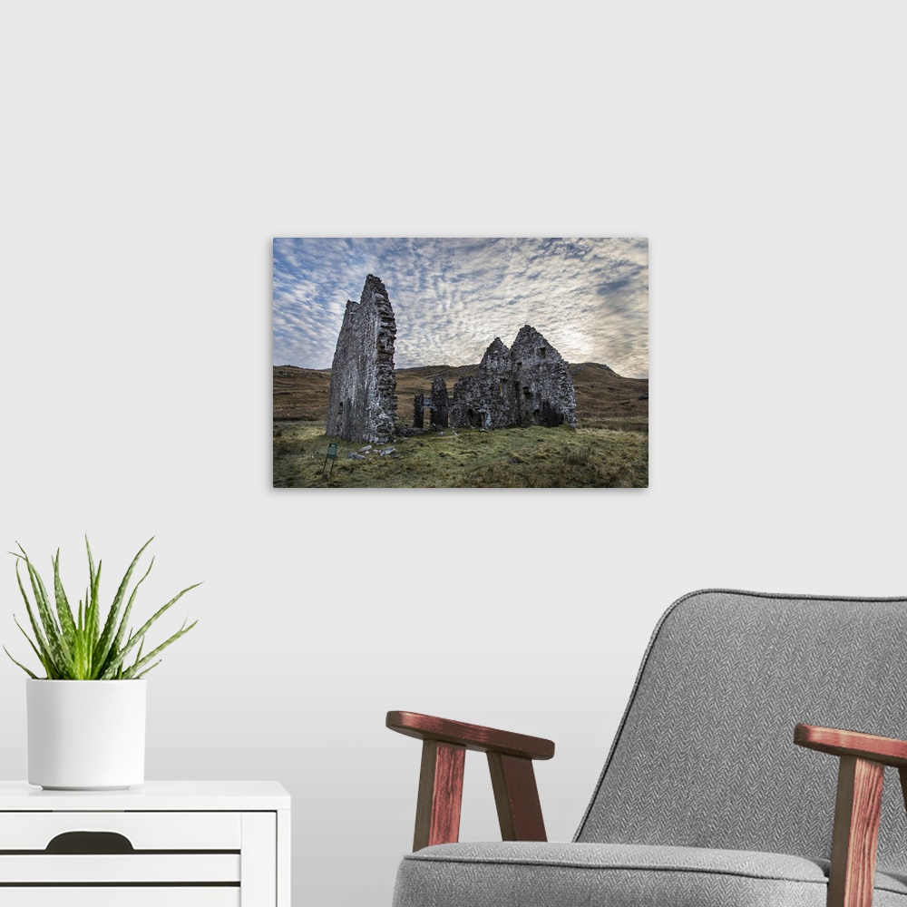 A modern room featuring A view toward Calda House ruins in the Scottish Highlands.